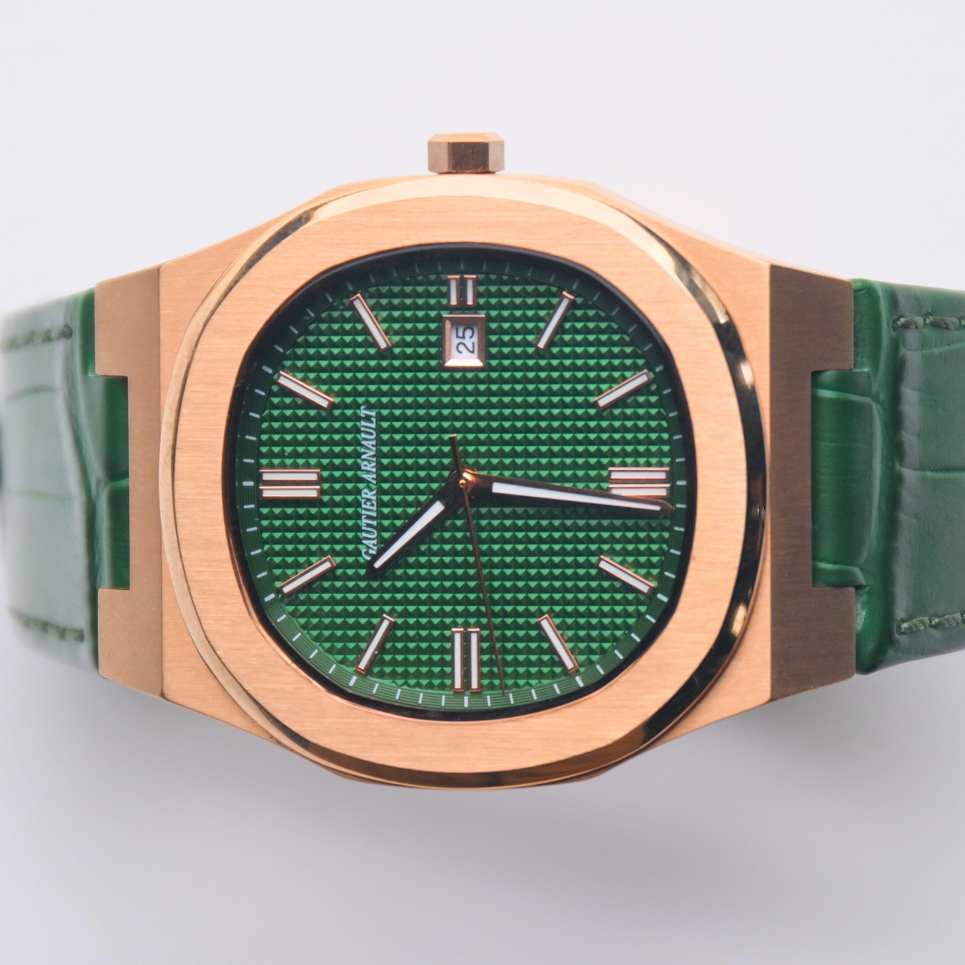 Watch with green face and green strap on a light gray background
